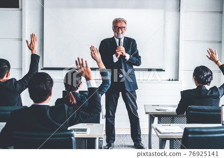 Senior leader speaker speaks to people audience. Senior leader speaker speaks to people audience. 76925141