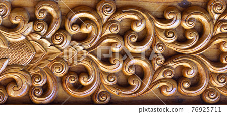 Carved wood background Carved wood background 76925711