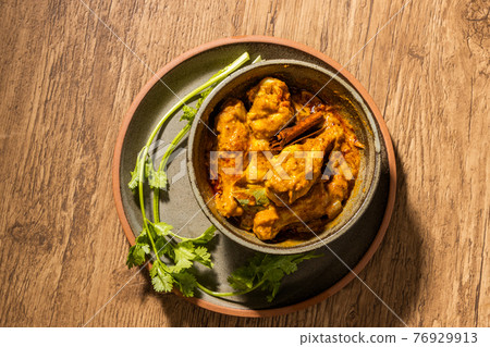 Chicken curry Asian style very spicy chicken curry 76929913