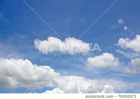 blue sky background with tiny clouds 76930871