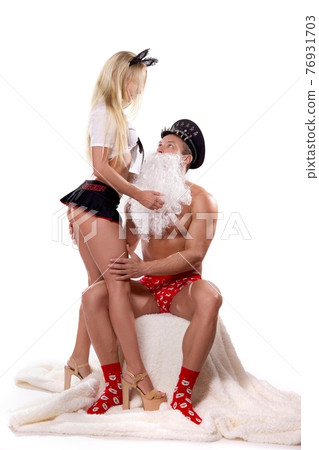 Man in Santa role play with dominance blonde woman 76931703
