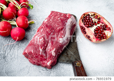 Organic beef meat raw steak, Filet mignon cut, on gray stone background Organic beef meat raw steak, Filet mignon cut, on gray stone background 76931979