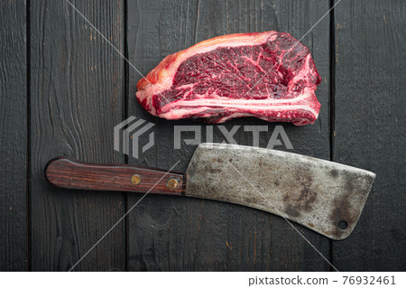 Raw beef steak, Club steak cut, on black wooden table , top view flat lay, with copy space for text 76932461