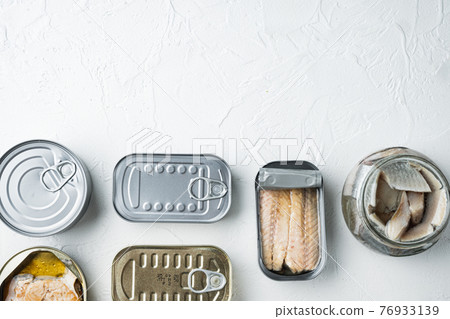 Assortment of cans of canned with different types of fish, on white background, top view flat lay, with copyspace and space for text Assortment of cans of canned with different types of fish, on white background, top view flat lay, with copyspace and space for text 76933139