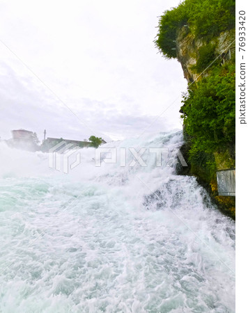Largest waterfall in Europe by River Rhein in Switzerland 76933420