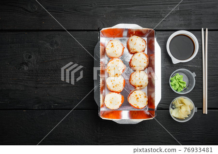 Sushi roll delivery, on black wooden table background, top view flat lay , with copyspace and space for text Sushi roll delivery, on black wooden table background, top view flat lay , with copyspace and space for text 76933481