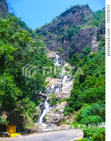 Large waterfalls in tropical forest at Nuwara Eliya, Sri Lanka. Large waterfalls in tropical forest at Nuwara Eliya, Sri Lanka. 76933631