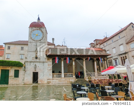 The Clock Tower of the former church of St. Sebastian with the statue of Justice The Clock Tower of the former church of St. Sebastian with the statue of Justice 76934811