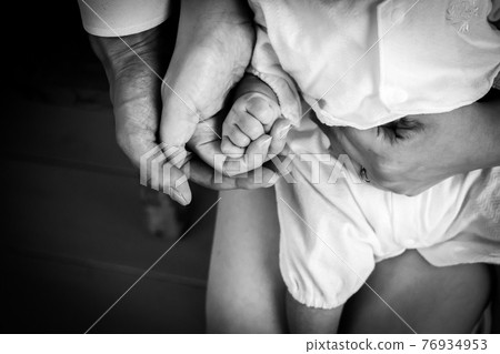 Dad, mom and baby hands Dad, mom and baby hands 76934953