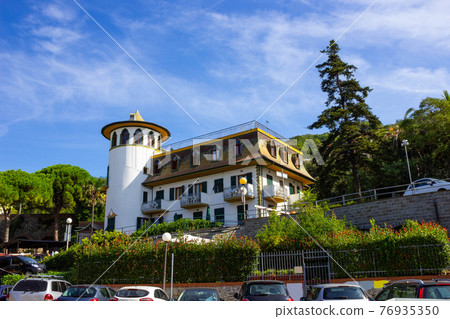 Cityscape with old building and palms in Moneglia village Cityscape with old building and palms in Moneglia village 76935350