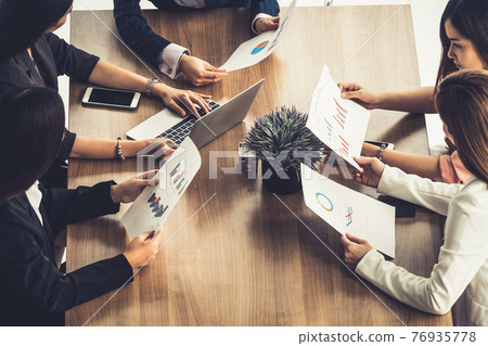Businesswomen in Meeting, Laptop Computer on Table Businesswomen in Meeting, Laptop Computer on Table 76935778