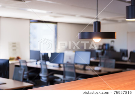 Image of an office that is quiet due to teleworking due to corona 76937816