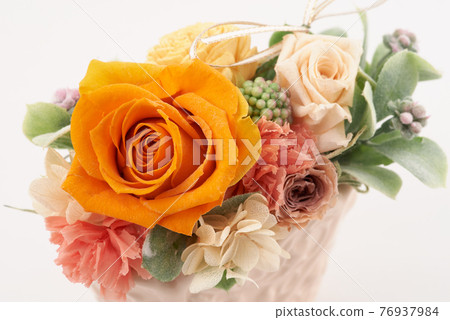 Preserved flowers with orange roses as the main 76937984