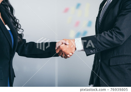 Business people handshake agreement in office. Business people handshake agreement in office. 76939805