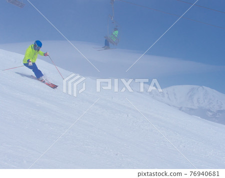 Hakuba Happoone Ski Resort Rabbit flat slope Skier skiing in light fog Hakuba Happoone Ski Resort Rabbit flat slope Skier skiing in light fog 76940681