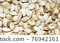 Roasted pumpkin vegetable seeds. 76942161