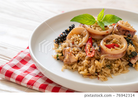 Basil and Spicy Herb Fried Rice with Squid or Octopus Basil and Spicy Herb Fried Rice with Squid or Octopus 76942314