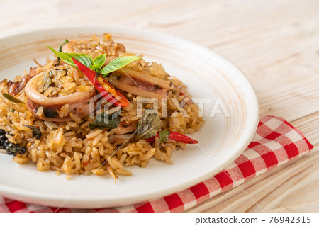 Basil and Spicy Herb Fried Rice with Squid or Octopus Basil and Spicy Herb Fried Rice with Squid or Octopus 76942315