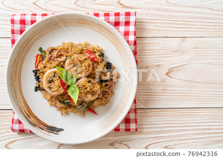 Basil and Spicy Herb Fried Rice with Squid or Octopus Basil and Spicy Herb Fried Rice with Squid or Octopus 76942316