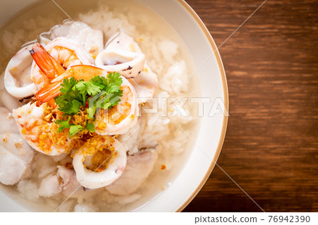 boiled rice soup with seafood 76942390