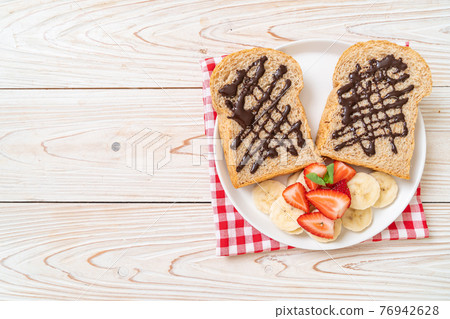 whole wheat bread with fresh banana, strawberry and chocolate whole wheat bread with fresh banana, strawberry and chocolate 76942628