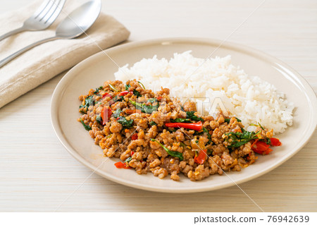 Stir fried Thai basil with minced pork on topped rice Stir fried Thai basil with minced pork on topped rice 76942639