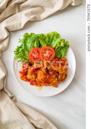 Fried fish topped with 3 flavors chili sauce Fried fish topped with 3 flavors chili sauce 76942878