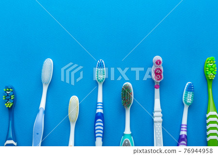 Toothbrush isolated in blue background. Toothbrush isolated in blue background. 76944958