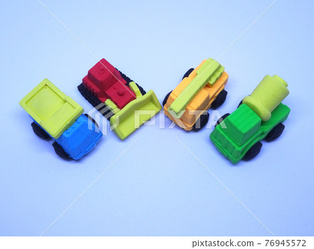 Miniature model of construction heavy machine made from colorful synthetic rubber isolated on white background. Miniature model of construction heavy machine made from colorful synthetic rubber isolated on white background. 76945572