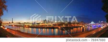 Moscow, Russia. Night. Panoramic view from the embankment of the Moskva River in the Kievsky train station, international business centre and bridges 76947880