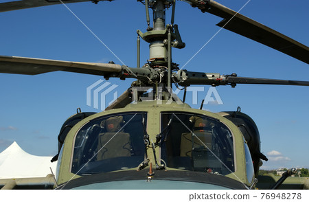 Details of the rotor and part of the body of modern military helicopters closeup 76948278