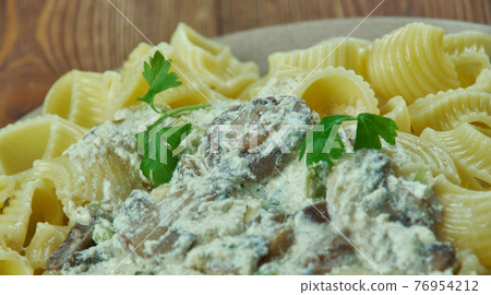 Italian pasta gomiti with mushroom sauce. Italian pasta gomiti with mushroom sauce. 76954212
