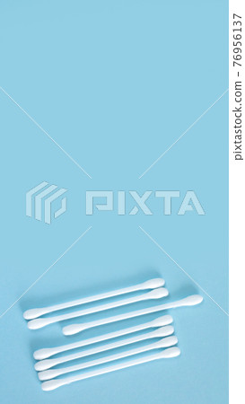 Flay lay of white plastic cotton sticks or swabs top view 76956137