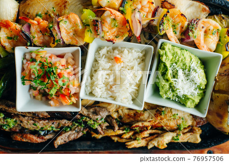 A variety of dishes on a ONE PLATE. Restaurant serving. Top view. mexican food. 76957506