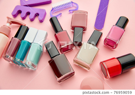 Nail care products, polish on pink background Nail care products, polish on pink background 76959059
