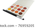 Red colored eye shadow palette and makeup brush 76959205