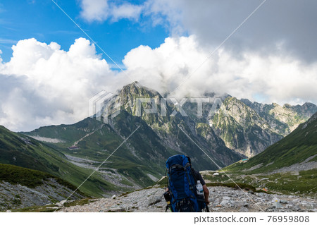 People who follow the majestic mountains and mountain trails 76959808