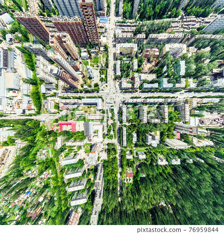 Aerial city view with crossroads and roads, houses, buildings, parks and parking lots. Sunny summer panoramic image Aerial city view with crossroads and roads, houses, buildings, parks and parking lots. Sunny summer panoramic image 76959844