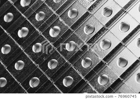 slide screw nuts in a row, abstract industrial background slide screw nuts in a row, abstract industrial background 76960745