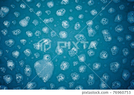 foam spots on blue water 76960753