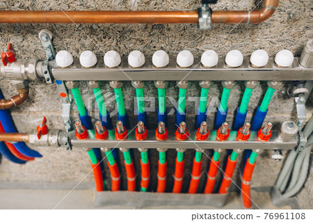 manifold collector with pipes of underfloor heating system manifold collector with pipes of underfloor heating system 76961108
