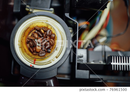 disassembled coffee machine at service center 76961500