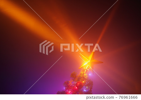 Christmas tree shiny star lights, purple background with mist 76961666