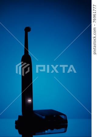 electric toothbrush silhouette, blue background electric toothbrush silhouette, blue background 76961777