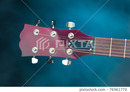 electric guitar head, blue background 76961778
