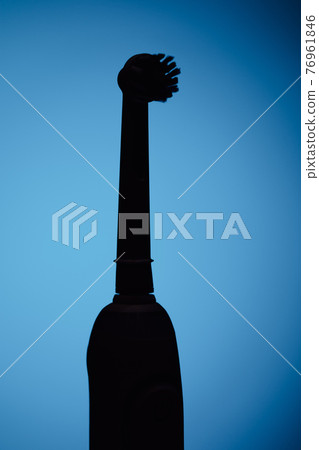 electric toothbrush silhouette, blue background electric toothbrush silhouette, blue background 76961846