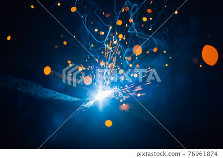 artistic welding sparks light, industrial background 76961874