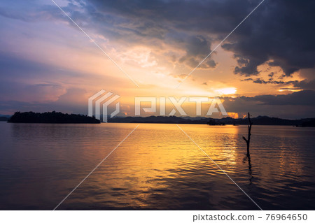Pom Pee reservoir at sunset with rays Pom Pee reservoir at sunset with rays 76964650