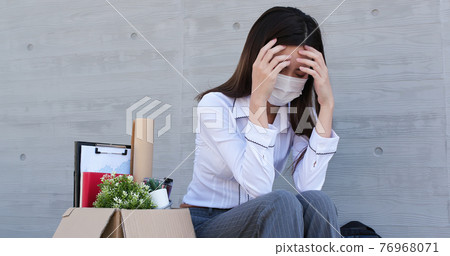 Asian woman is laid off 76968071