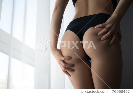 Crop woman with perfect buttocks 76968492